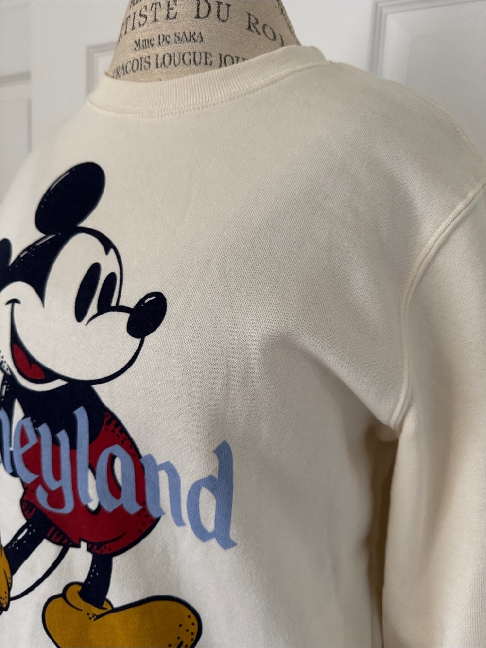 Disney brand Cream colored Mouse Sweater. NWOT